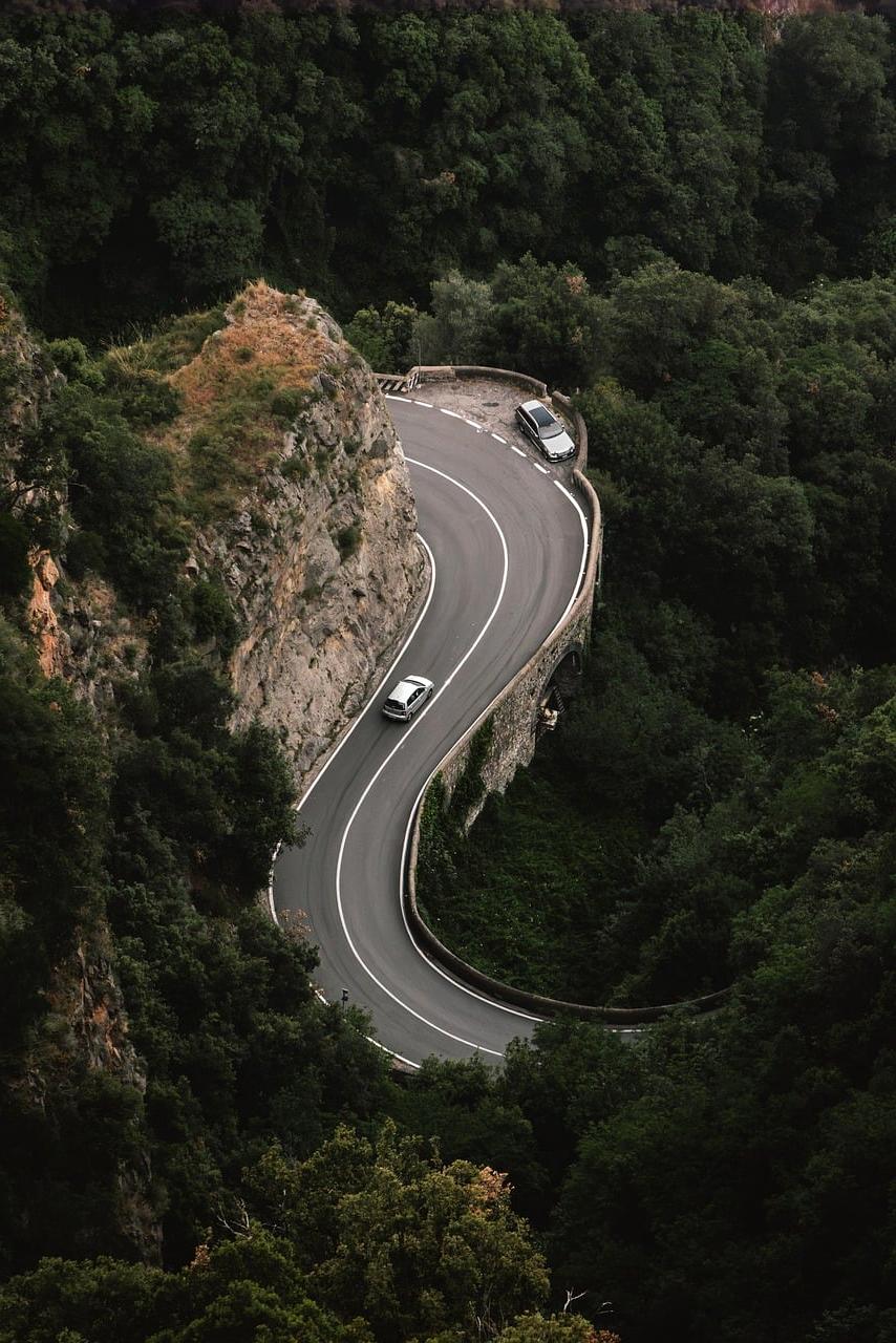 Mountain landscape with a winding road leading to the horizon